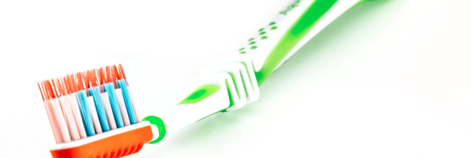 Green and orange toothbrush