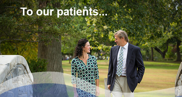 Dr. Shannon Arndt and Dr. Raymond Orzechowski walking side by side