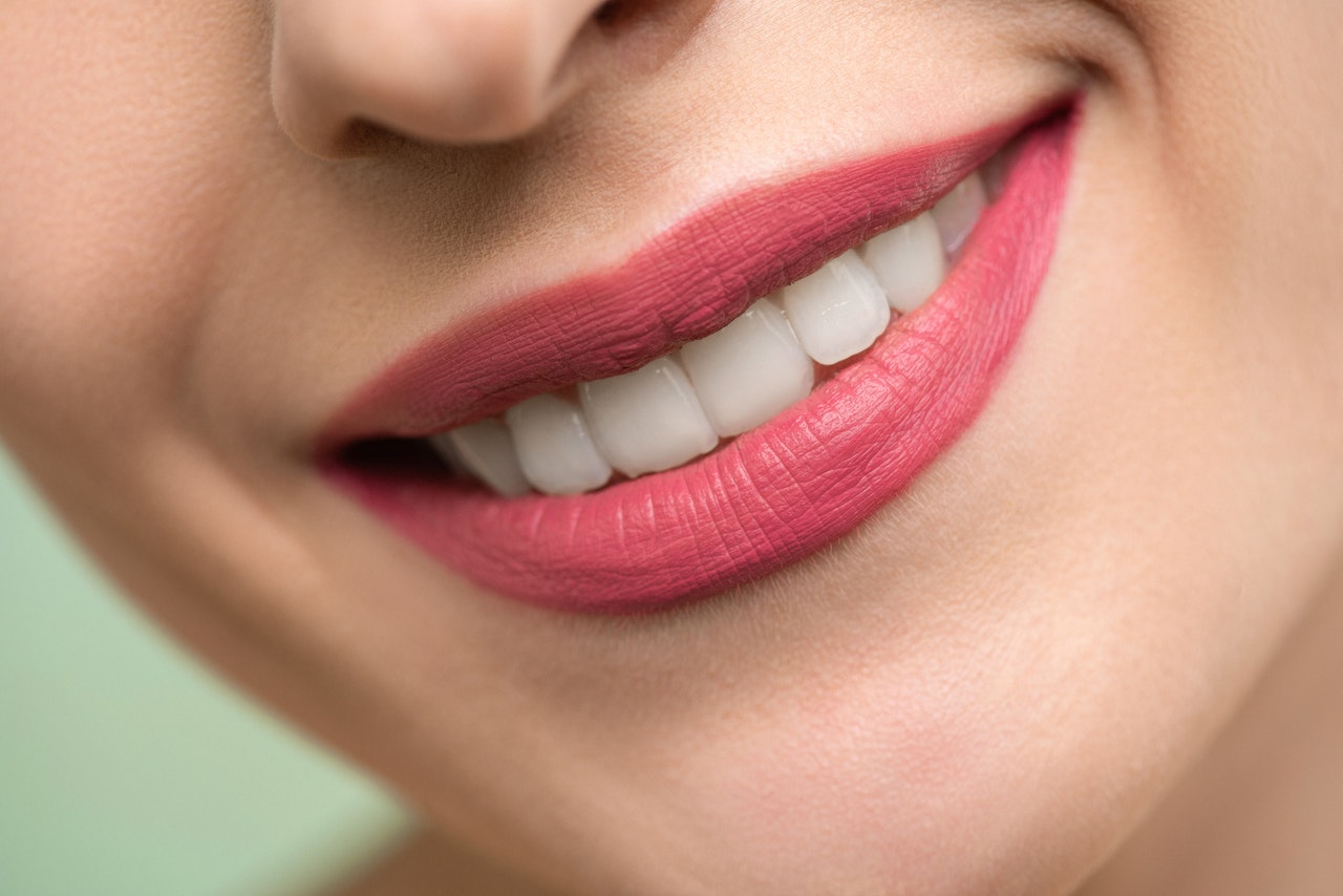 Woman smiling with red lipstick