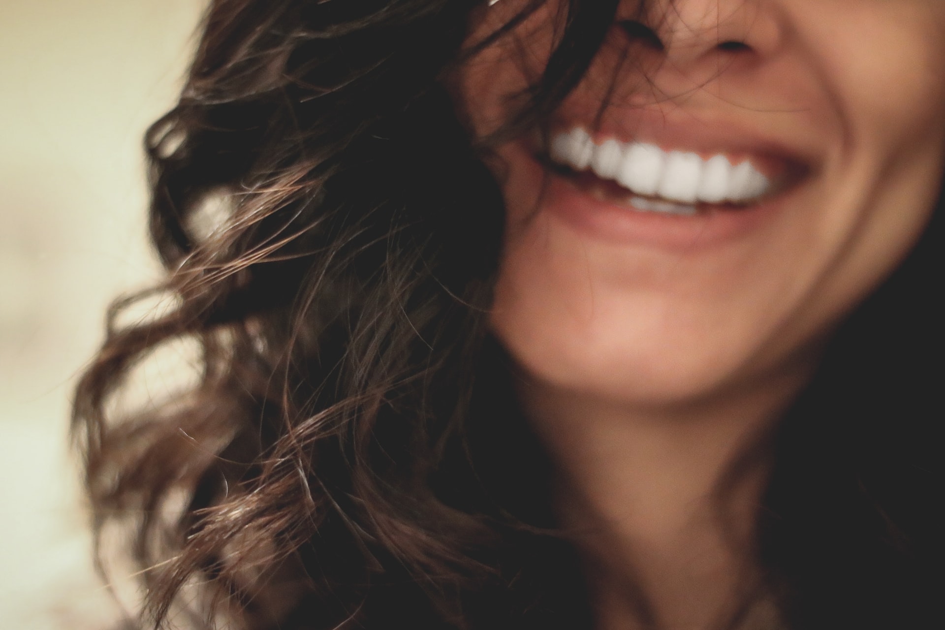 Woman with dark hair smiling