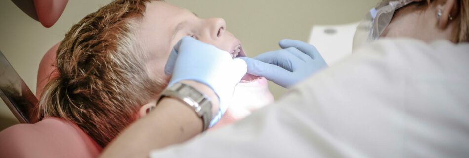 Child receiving a dental examination.